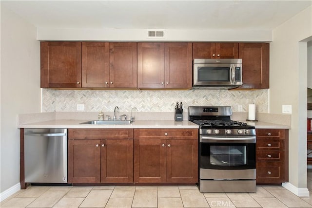 27441 Abanico, Mission Viejo, CA 92691 - kitchen with a sink, stainless steel appliances, backsplash, and light countertops
