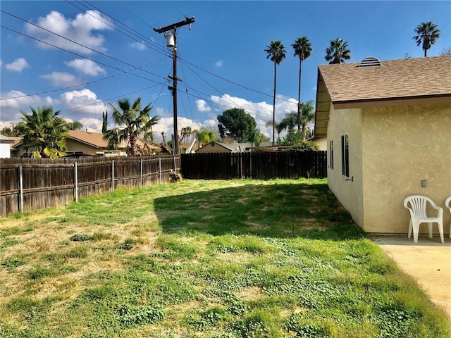 view of yard with a fenced backyard