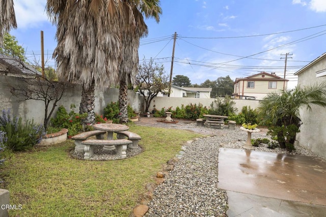view of yard featuring a fenced backyard and a patio area