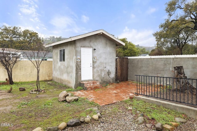 view of outbuilding with an outdoor structure and a fenced backyard
