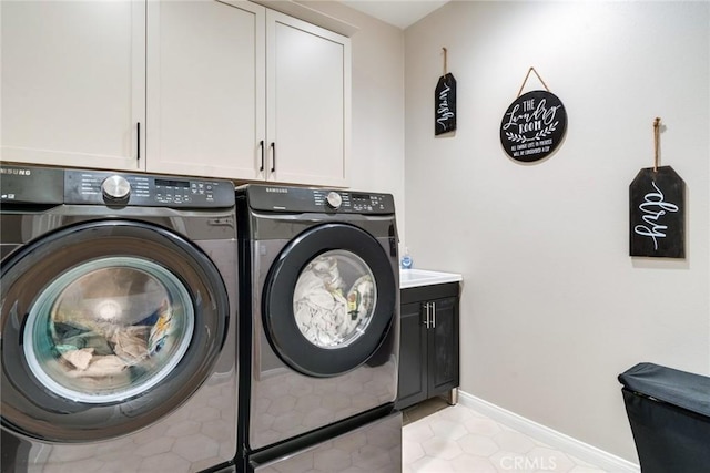6288 Barb Way, Jurupa Valley, CA 92509 - laundry room featuring washer and clothes dryer, cabinet space, light tile patterned floors, and baseboards