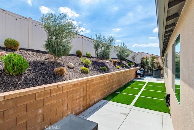 6288 Barb Way, Jurupa Valley, CA 92509 - fenced backyard featuring a patio area and central AC unit
