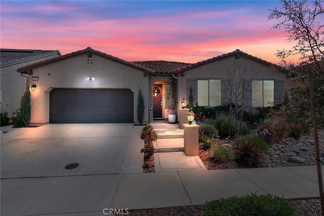 6288 Barb Way, Jurupa Valley, CA 92509 - mediterranean / spanish house with driveway, a garage, stucco siding, and a tiled roof