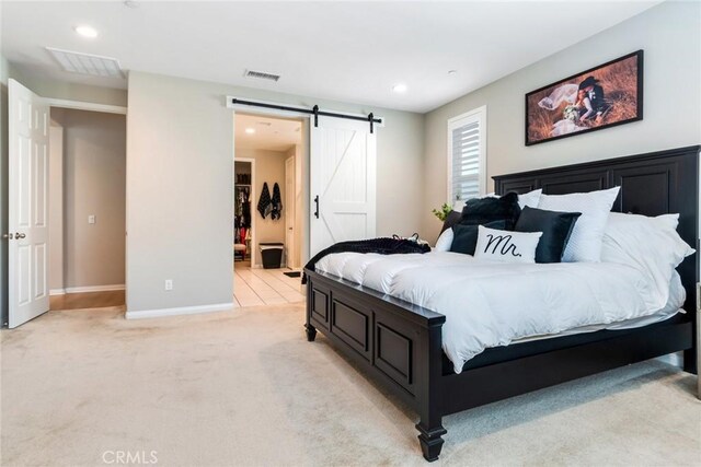 6288 Barb Way, Jurupa Valley, CA 92509 - bedroom with light colored carpet, a barn door, baseboards, and recessed lighting