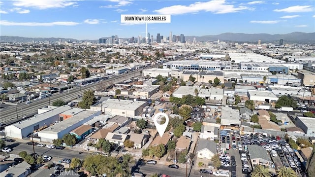 birds eye view of property featuring a mountain view and a city view