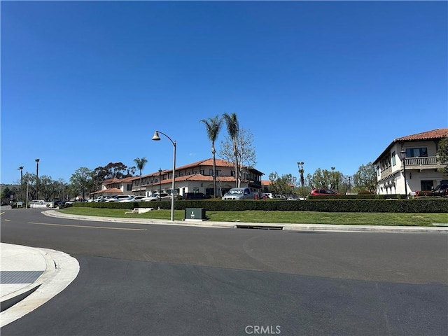 31937 Via Encima, San Juan Capistrano, CA 92675 - view of asphalt road featuring street lights, sidewalks, and curbs