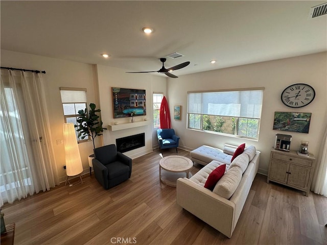 31937 Via Encima, San Juan Capistrano, CA 92675 - living room with a fireplace, plenty of natural light, wood finished floors, and recessed lighting
