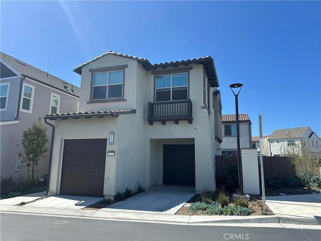 31937 Via Encima, San Juan Capistrano, CA 92675 - view of front facade with stucco siding, an attached garage, a tile roof, and fence