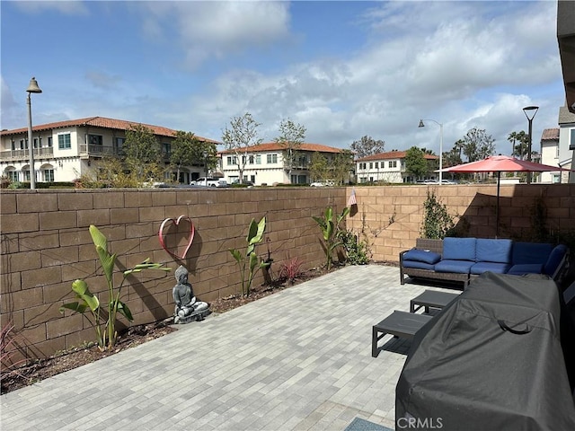 31937 Via Encima, San Juan Capistrano, CA 92675 - view of patio featuring a residential view, a fenced backyard, and an outdoor living space