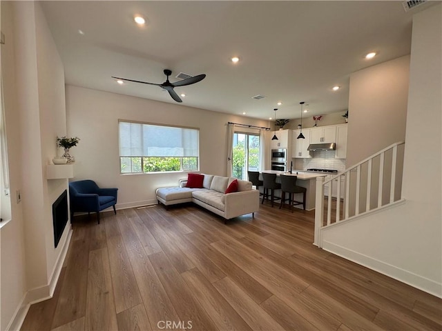 31937 Via Encima, San Juan Capistrano, CA 92675 - living area with wood finished floors, baseboards, a ceiling fan, recessed lighting, and stairway