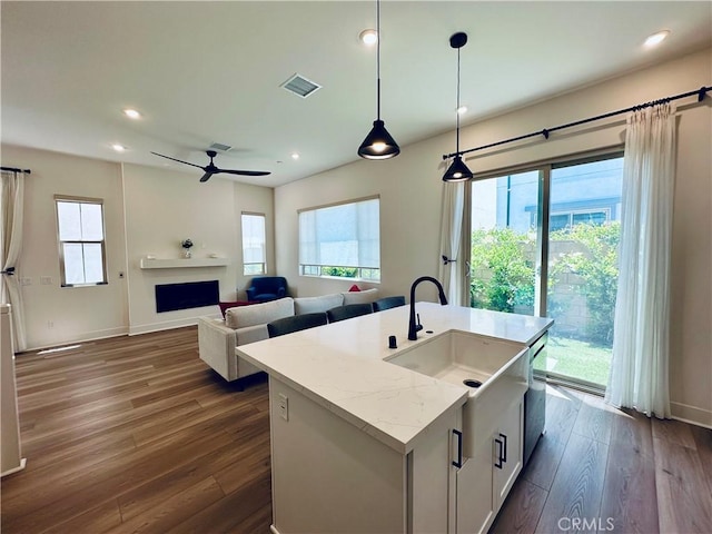 31937 Via Encima, San Juan Capistrano, CA 92675 - kitchen featuring a sink, dark wood finished floors, recessed lighting, a fireplace, and pendant lighting