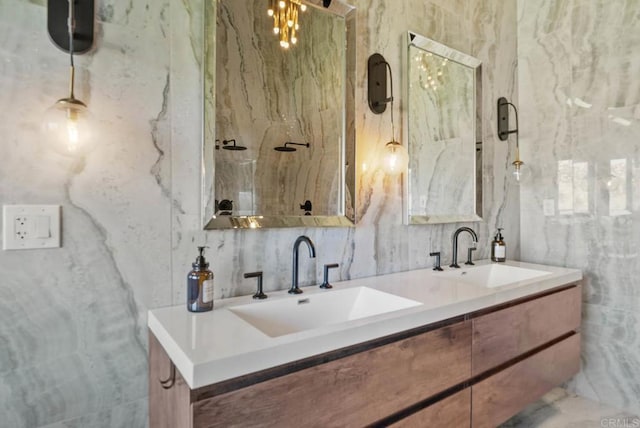 24949 Thunder Mountain Rd, Ramona, CA 92065 - full bathroom with double vanity, tile walls, a marble finish shower, and a sink