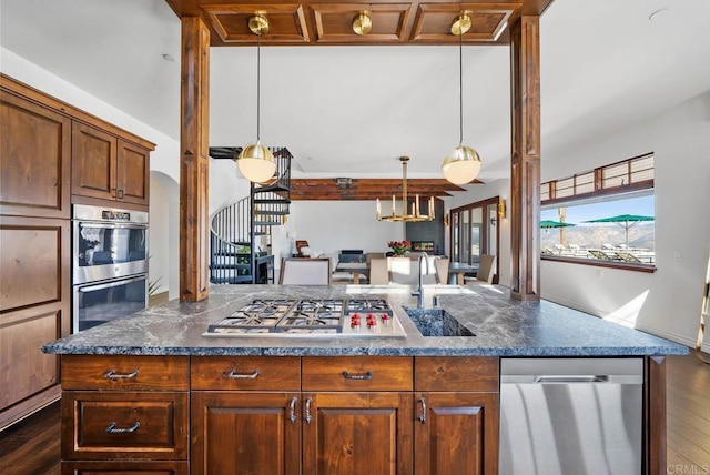24949 Thunder Mountain Rd, Ramona, CA 92065 - kitchen with stainless steel appliances, a kitchen island, dark countertops, and dark wood finished floors