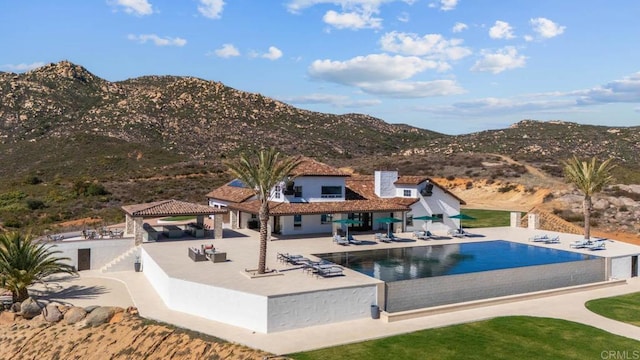 24949 Thunder Mountain Rd, Ramona, CA 92065 - view of swimming pool with an infinity pool, a gazebo, a mountain view, fence private yard, and a patio area