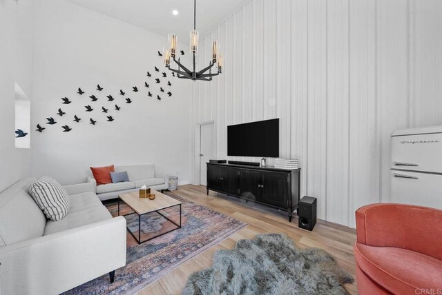 24949 Thunder Mountain Rd, Ramona, CA 92065 - living area with recessed lighting, light wood-style floors, an inviting chandelier, and a towering ceiling