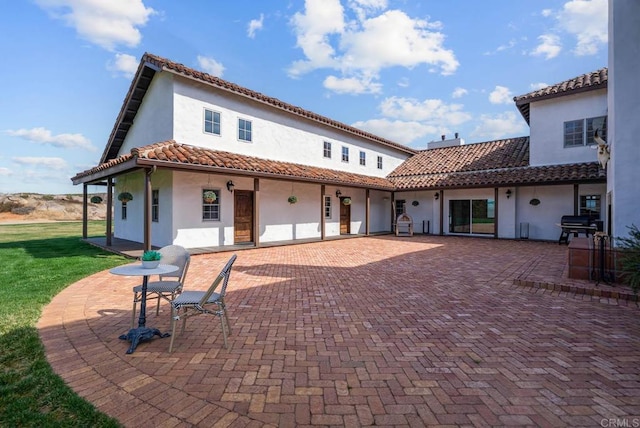 24949 Thunder Mountain Rd, Ramona, CA 92065 - back of property with a tile roof, a yard, a patio area, and stucco siding