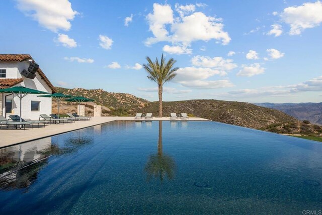 24949 Thunder Mountain Rd, Ramona, CA 92065 - pool with a mountain view and a patio area