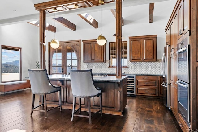 24949 Thunder Mountain Rd, Ramona, CA 92065 - kitchen with lofted ceiling with beams, wine cooler, backsplash, and a wealth of natural light