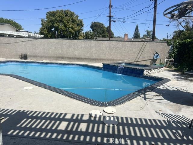 view of swimming pool featuring a fenced in pool, a patio, and fence private yard