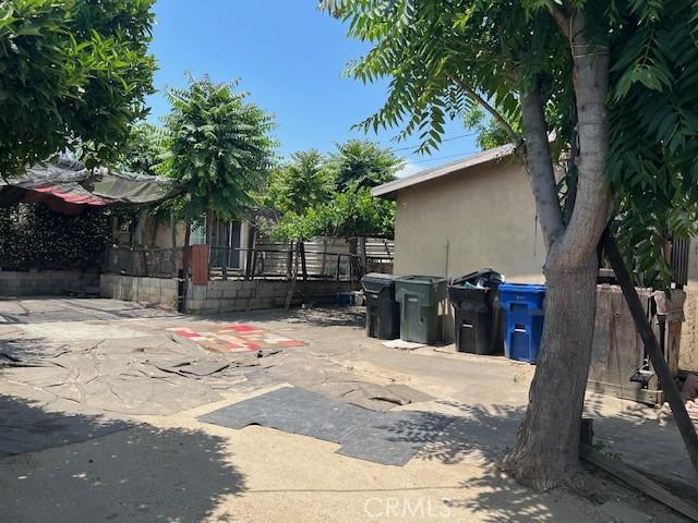 1320 N Grove Ave, Ontario, CA 91764 - view of side of home featuring a patio area and stucco siding