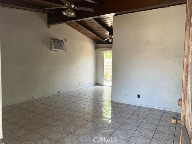 1320 N Grove Ave, Ontario, CA 91764 - unfurnished room featuring a ceiling fan, wood ceiling, and a wall mounted air conditioner