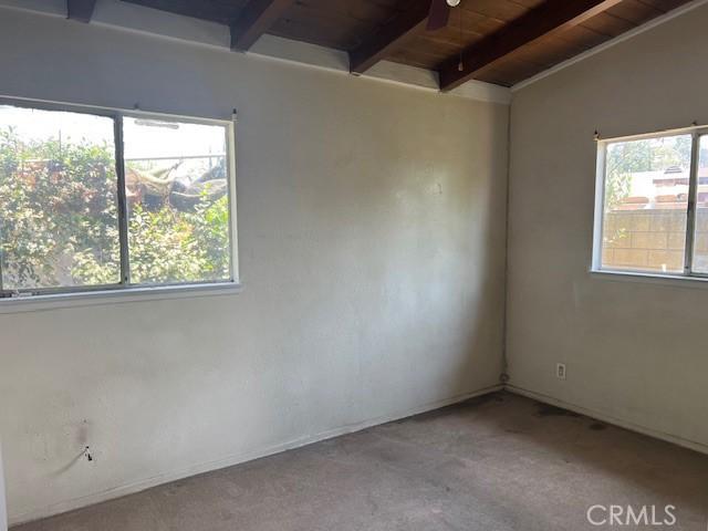 1320 N Grove Ave, Ontario, CA 91764 - empty room with wood ceiling, carpet floors, and ceiling fan