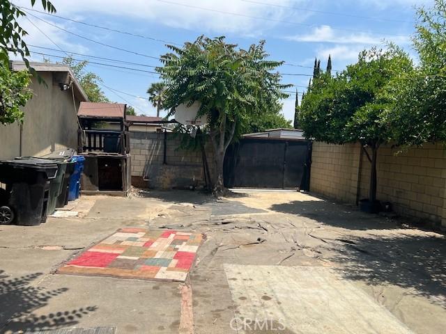 1320 N Grove Ave, Ontario, CA 91764 - fenced backyard with a patio area