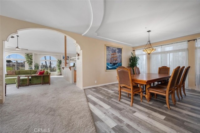 2913 Harris Dr, Vista, CA 92084 - dining room featuring baseboards, wood finished floors, arched walkways, and ceiling fan