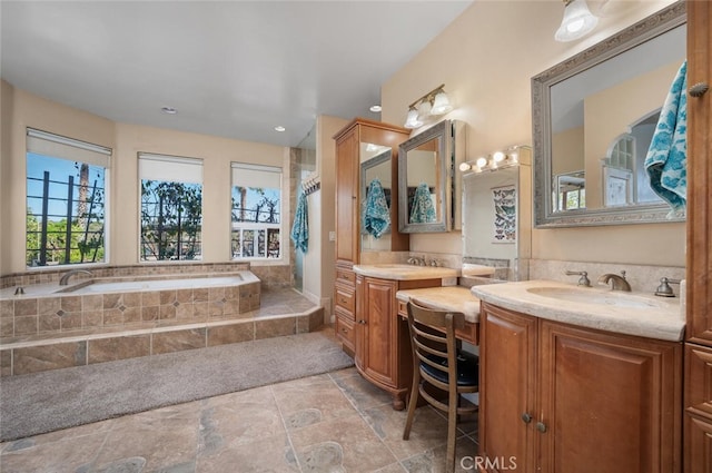 2913 Harris Dr, Vista, CA 92084 - bathroom featuring stone finish floor, a sink, a bath, and two vanities