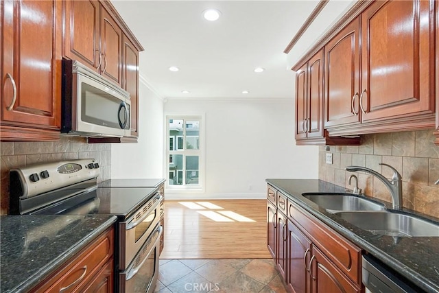 6160 Whitsett Ave Unit 6, North Hollywood, CA 91606 - kitchen featuring stainless steel appliances, ornamental molding, dark stone countertops, backsplash, and recessed lighting