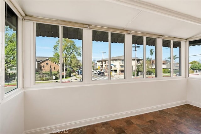 unfurnished sunroom with a healthy amount of sunlight