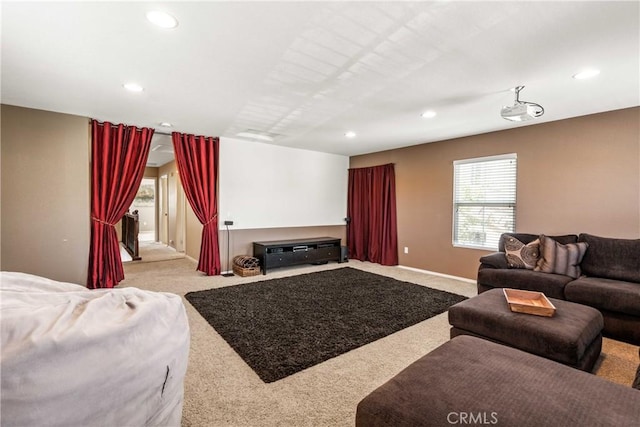 living area featuring recessed lighting and carpet