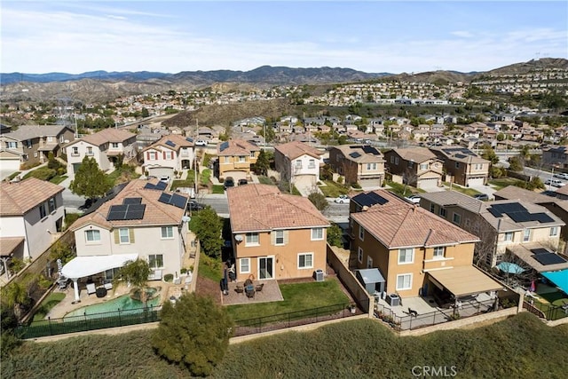 birds eye view of property with a residential view and a mountain view