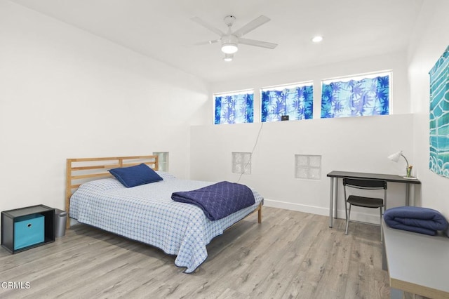 bedroom featuring recessed lighting, a ceiling fan, baseboards, and wood finished floors