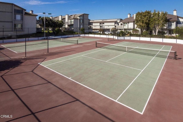 view of sport court featuring a residential view and community basketball court