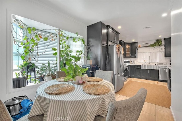 1027 W Durness St, West Covina, CA 91790 - dining space featuring plenty of natural light, crown molding, and recessed lighting