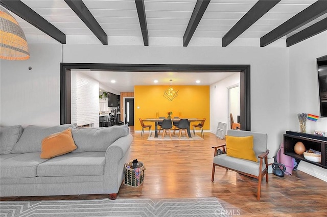 1027 W Durness St, West Covina, CA 91790 - living room featuring beam ceiling, wood finished floors, recessed lighting, and baseboards