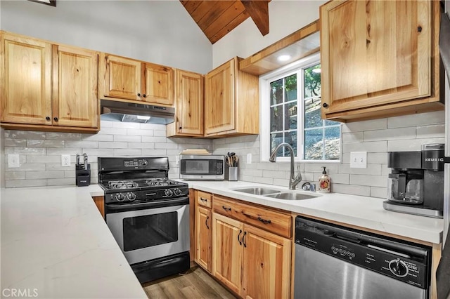 272 Fairway Dr, Lake Arrowhead, CA 92352 - kitchen featuring stainless steel appliances, under cabinet range hood, backsplash, wood finished floors, and wood ceiling