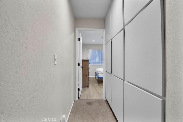 272 Fairway Dr, Lake Arrowhead, CA 92352 - hallway with a textured wall and light carpet