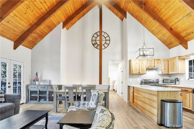 272 Fairway Dr, Lake Arrowhead, CA 92352 - living room with high vaulted ceiling, a wooden ceiling with exposed beams, a chandelier, light wood finished floors, and french doors