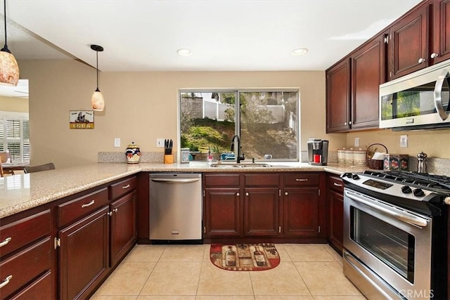 718 Cherry St, Corona, CA 92881 - kitchen featuring a healthy amount of sunlight, appliances with stainless steel finishes, pendant lighting, and a sink