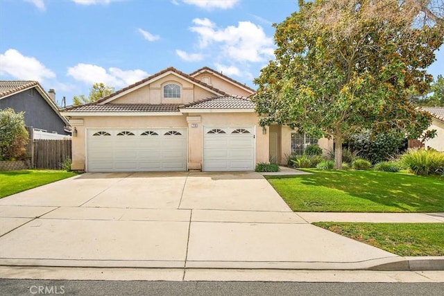718 Cherry St, Corona, CA 92881 - view of front of home with stucco siding, driveway, a front lawn, a garage, and a tiled roof