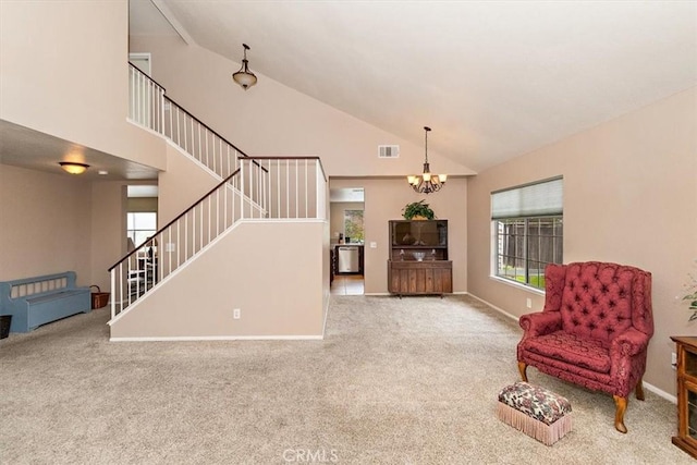 718 Cherry St, Corona, CA 92881 - sitting room featuring visible vents, stairs, carpet flooring, a notable chandelier, and high vaulted ceiling