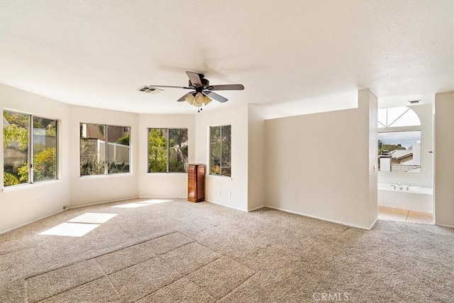 718 Cherry St, Corona, CA 92881 - unfurnished room featuring visible vents, light colored carpet, a textured ceiling, and ceiling fan