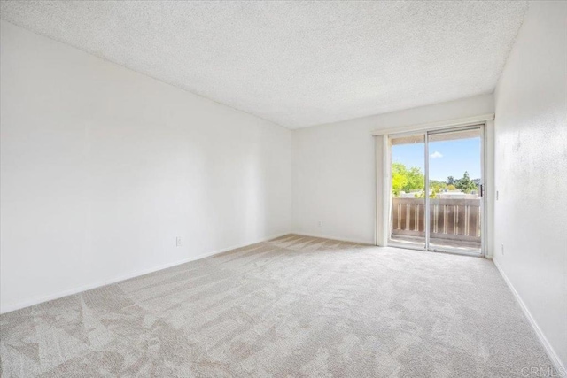 5700 Baltimore Dr Unit 232, La Mesa, CA 91942 - unfurnished room featuring a textured ceiling, carpet floors, and baseboards