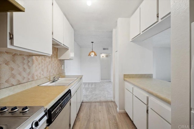5700 Baltimore Dr Unit 232, La Mesa, CA 91942 - kitchen with a sink, light countertops, dishwashing machine, and light wood-style floors