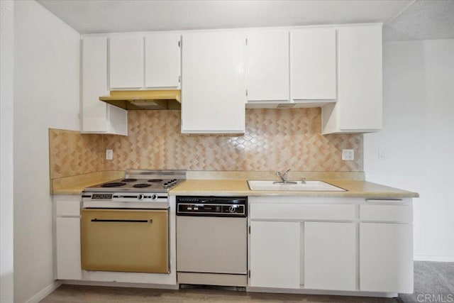 5700 Baltimore Dr Unit 232, La Mesa, CA 91942 - kitchen featuring under cabinet range hood, dishwasher, a sink, light countertops, and white cabinets