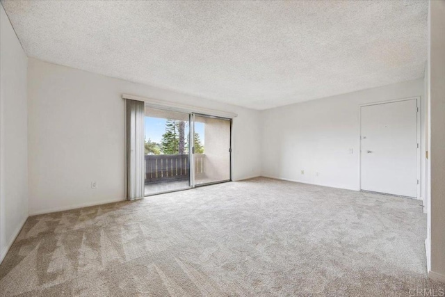 5700 Baltimore Dr Unit 232, La Mesa, CA 91942 - spare room featuring a textured ceiling and carpet floors