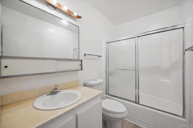 5700 Baltimore Dr Unit 232, La Mesa, CA 91942 - bathroom with toilet, vanity, and combined bath / shower with glass door