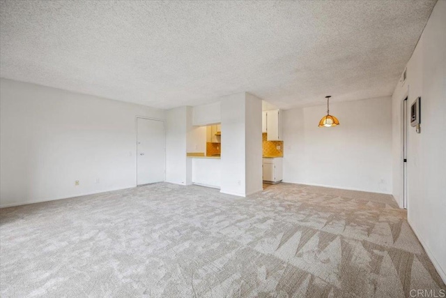 5700 Baltimore Dr Unit 232, La Mesa, CA 91942 - spare room with light colored carpet, a textured ceiling, and baseboards